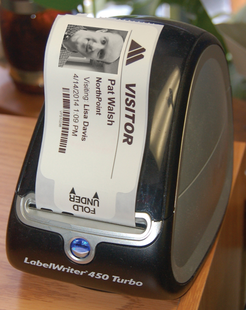 A Dymo Turbo 450 thermal printer creates an adhesive badge for your visitor in seconds.